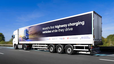 An e-truck charges while driving in France.