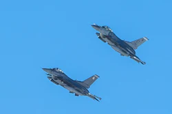 Two U.S. Air Force jets equipped with IVEWS and SABR fly at Nellis Air Force Base, Nevada.