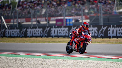 A Ducati model on the MotoGP track.