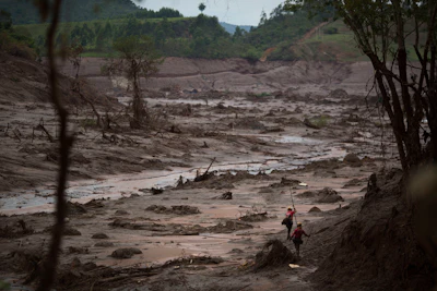 Rescue workers search for victims in Bento Rodrigues, Brazil, days after a dam burst on Nov. 8, 2015.