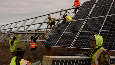 Workers install panels at a solar project May 21, 2025, in Galena, Alaska.