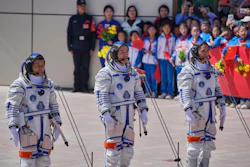 Chinese astronaut for the Shenzhou 20 mission, Chen Dong, center, speaks next to his comrades Chen Zhongrui, right, and Wang Jie as they attend a send-off ceremony for their manned space mission at the Jiuquan Satellite Launch Center in northwestern China, Thursday, April 24, 2025.