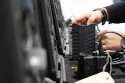 A worker packs away assembled counter drone devices at MyDefence's headquarters in Alborg, Denmark, on Oct. 28, 2025.