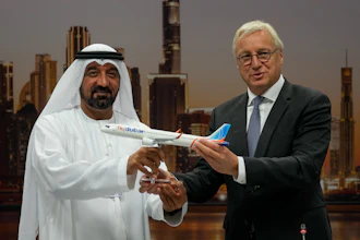 Airbus' CEO of commercial aircraft Christian Scherer presents a model of Airbus A321neo aircraft to Sheikh Ahmed bin Saeed Al Maktoum, the chairman and chief executive of Emirates and chairman of FlyDubai at a press conference to announce an order for 150 Airbus A321neo aircraft at the Dubai Air Show, United Arab Emirates, Tuesday, Nov. 18, 2025.