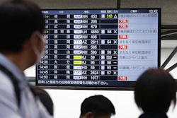 The departures display board shows All Nippon Airways' multipule flights cancellation at Haneda airport in Tokyo Saturday, Nov. 29, 2025.