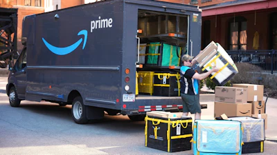 An Amazon Prime driver makes a delivery outside an apartment building in Pittsburgh, March 10, 2025.