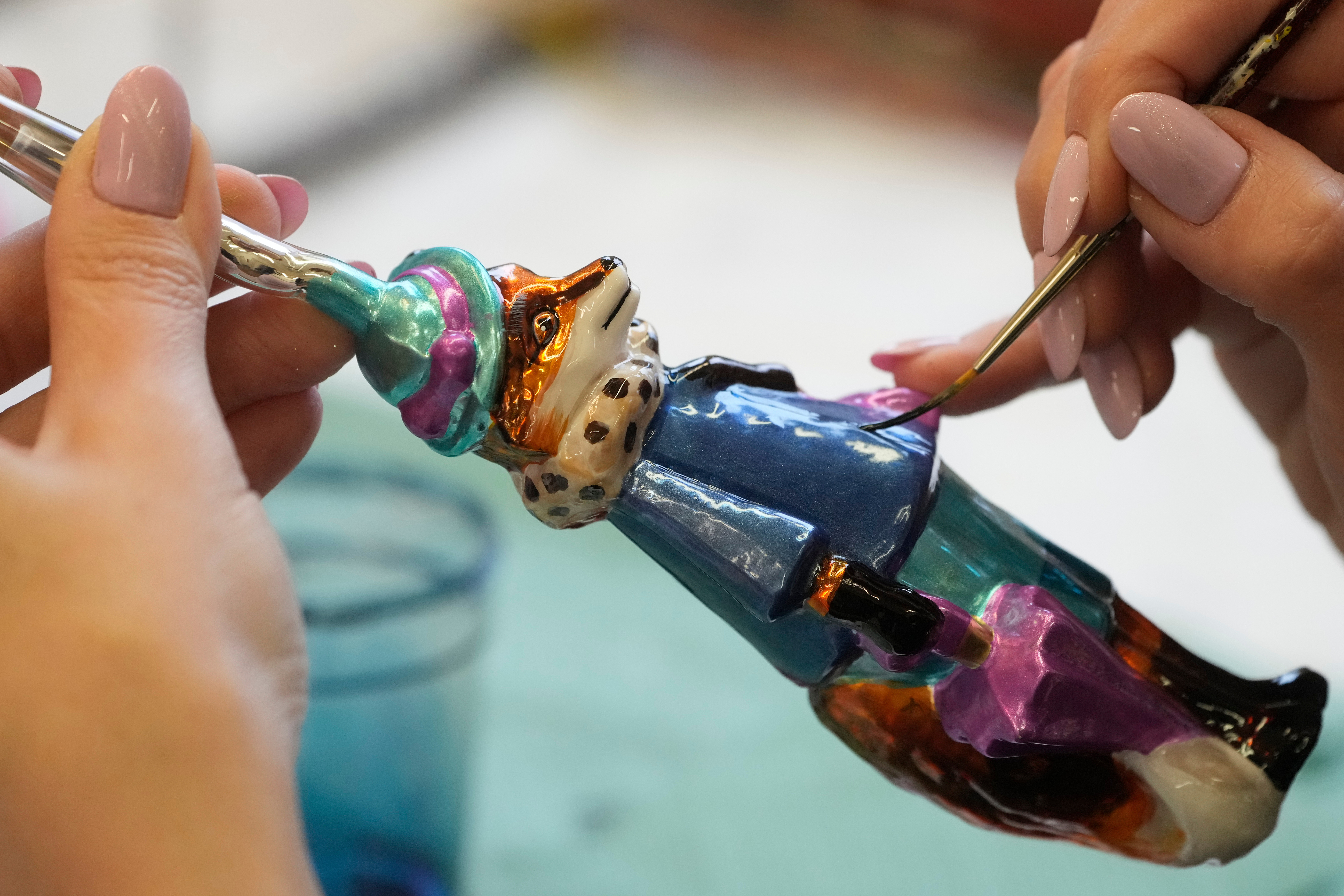 A worker prepares a hand-made Christmas bauble at GlitterLab in Czestochowa, southern Poland, on Nov. 21, 2025.