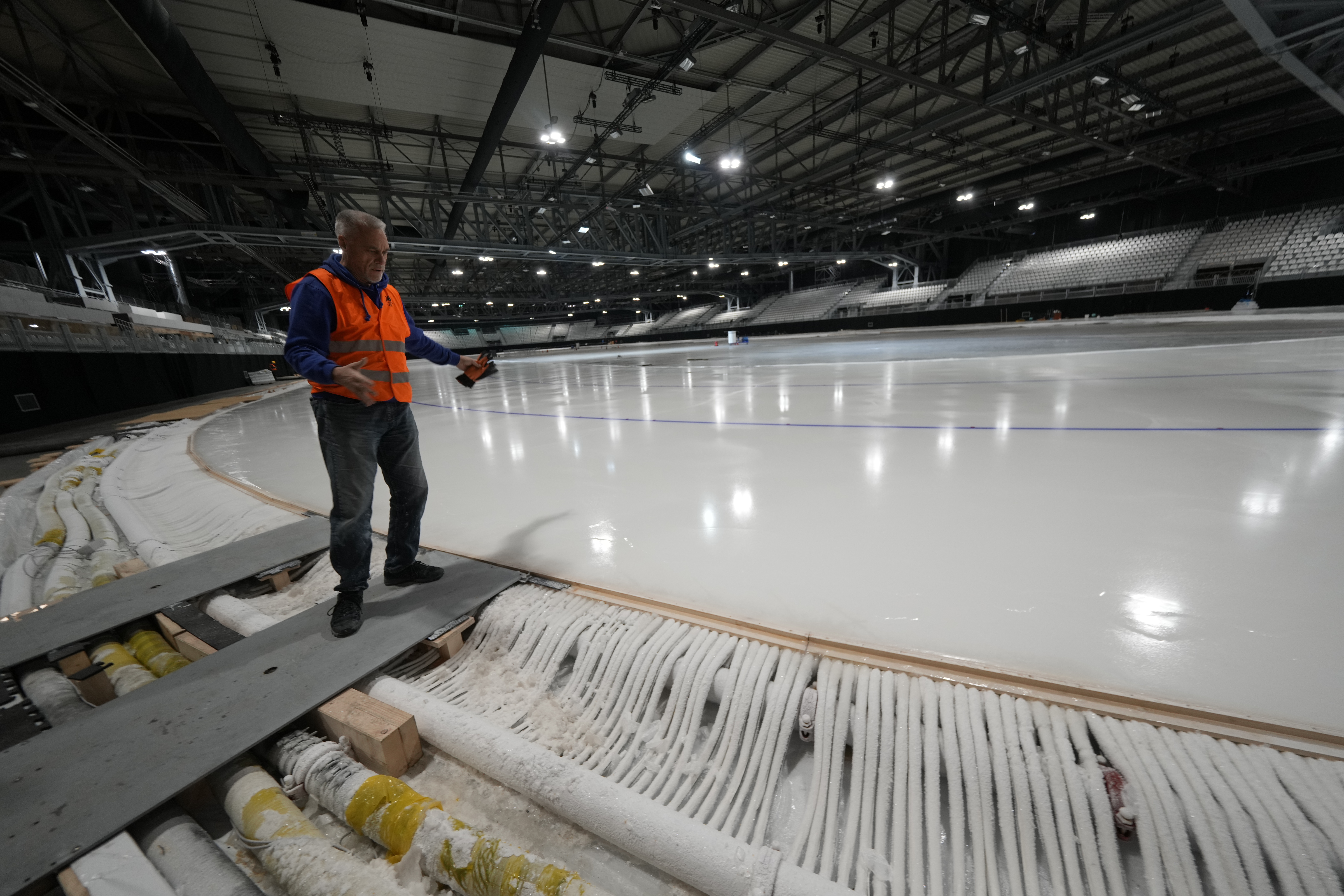 Ice Master Mark Messer poses in the stadium where speed skating discipline of the Milan Cortina 2026 Winter Olympics will take place, in Rho, outskirt of Milan, Tuesday, Nov. 11, 2025.