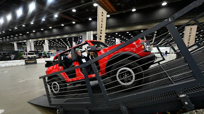 Guests are given a ride in a Bronco on a track at the Detroit Auto Show, Friday, Jan. 10, 2025, in Detroit.