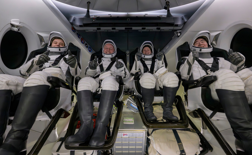 Roscosmos cosmonaut Oleg Platonov, left, NASA astronauts Mike Fincke, Zena Cardman, and JAXA (Japan Aerospace Exploration Agency) astronaut Kimiya Yui are seen inside the SpaceX Dragon Endeavour spacecraft onboard the SpaceX recovery ship SHANNON shortly after having landed in the Pacific Ocean off the coast of Long Beach, Calif., Thursday, Jan. 15, 2026.