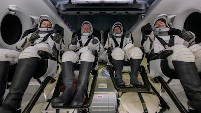 Roscosmos cosmonaut Oleg Platonov, left, NASA astronauts Mike Fincke, Zena Cardman, and JAXA (Japan Aerospace Exploration Agency) astronaut Kimiya Yui are seen inside the SpaceX Dragon Endeavour spacecraft onboard the SpaceX recovery ship SHANNON shortly after having landed in the Pacific Ocean off the coast of Long Beach, Calif., Thursday, Jan. 15, 2026.