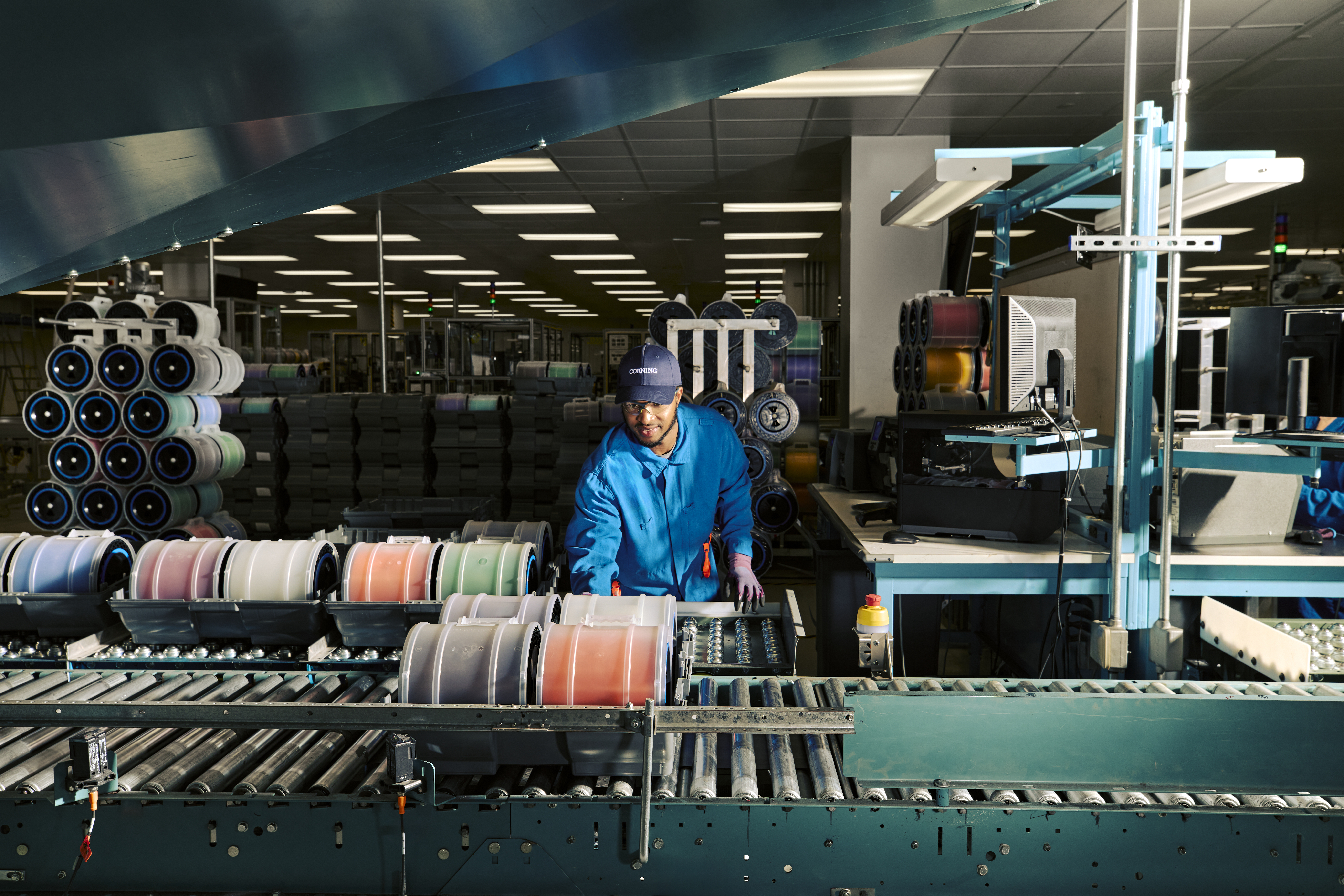 An employee processing fiber at a Corning optical fiber manufacturing facility in Concord, North Carolina.