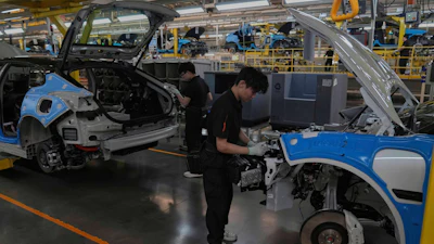 Workers assemble the Zeekr 001 EV models at the Chinese automaker Zeekr assembly plant in Ningbo, east China's Zhejiang Province, April 17, 2025.