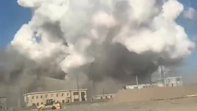 In this photo released by Xinhua News Agency, smoke rises from the site of explosions from a factory in Baotou, in north China's Inner Mongolia Autonomous Region, Sunday, Jan. 18, 2026.