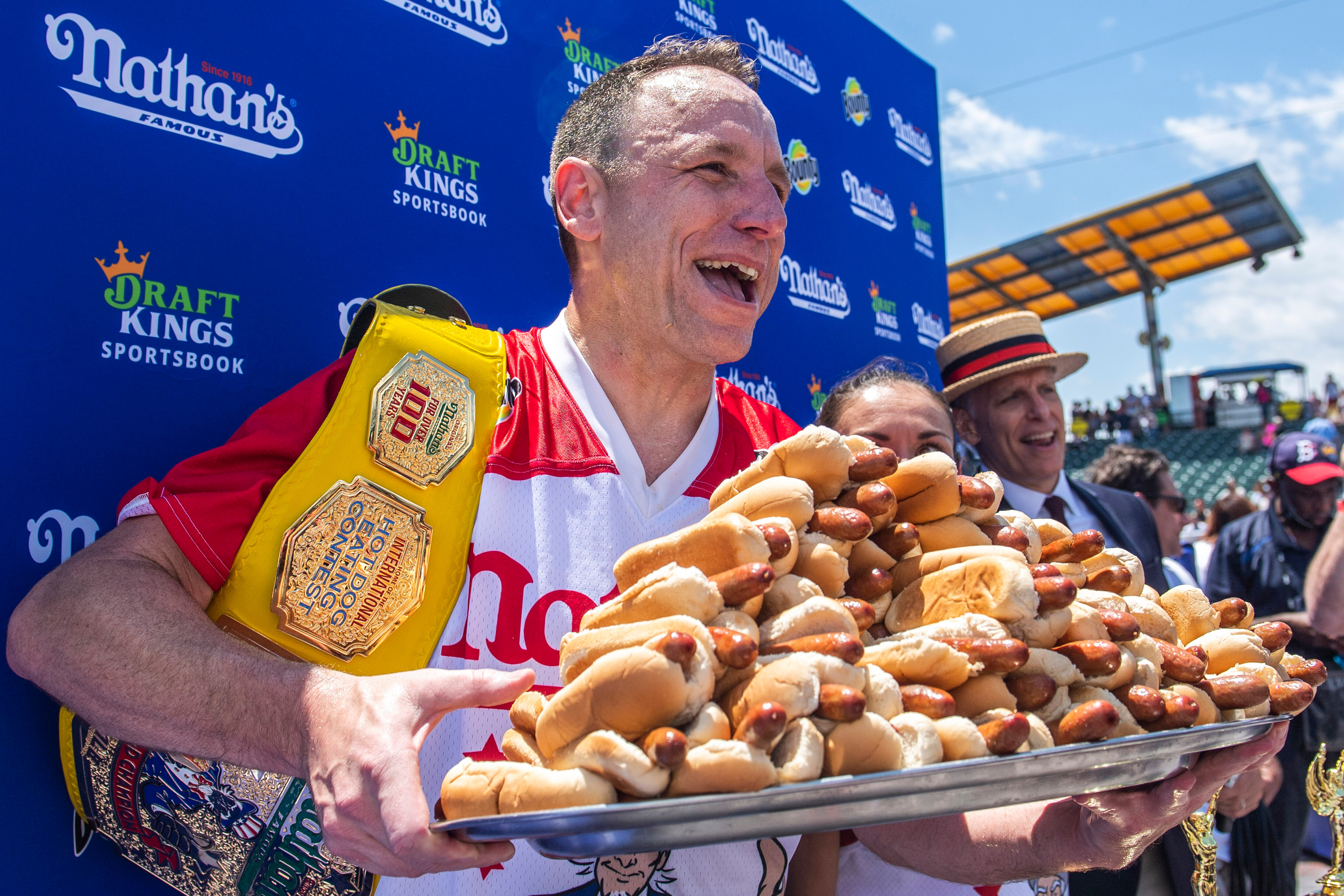 Joey Chestnut, winner of the 2021 Nathan's Famous Fourth of July International Hot Dog-Eating Contest, poses for photos in Coney Island's Maimonides Park, July 4, 2021, in the Brooklyn borough of New York.