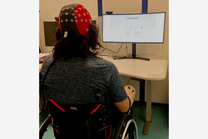 Signals from an EEG monitoring device could be used to send brain signals to a spinal cord stimulator, helping paralyzed patients control their limbs more effectively.