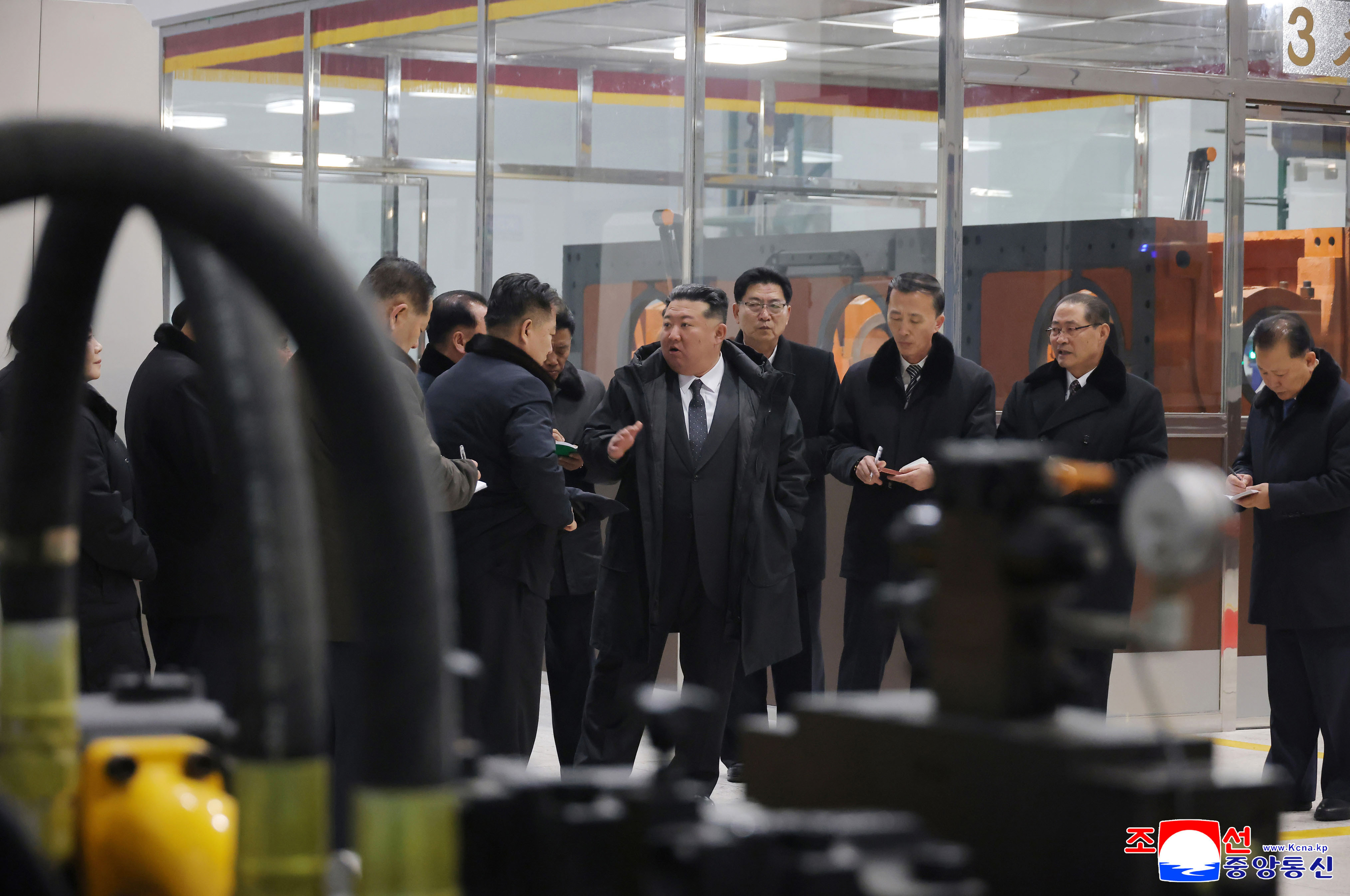 In this photo provided by the North Korean government, North Korean leader Kim Jong Un, center, visits the Ryongsong Machine Complex in North Korea Monday, Jan. 19, 2026. Independent journalists were not given access to cover the event depicted in this image distributed by the North Korean government. The content of this image is as provided and cannot be independently verified. Korean language watermark on image as provided by source reads: 'KCNA' which is the abbreviation for Korean Central News Agency.