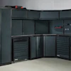Dark gray modular garage storage system with tool drawers and wall panels