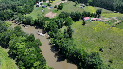Faye Jackson has lived for decades on a patch of rural land, right, in Resaca, Ga., on the banks of the Conasauga River, seen on Thursday, May 8, 2025.