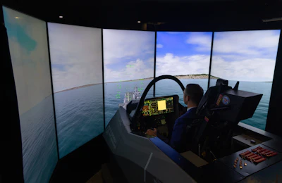 Robert Paul, with Lockheed Martin, demonstrates a cockpit simulator for the F-35 Lightning II fighter jet during the Singapore Air Show on Tuesday, Feb. 3, 2026.