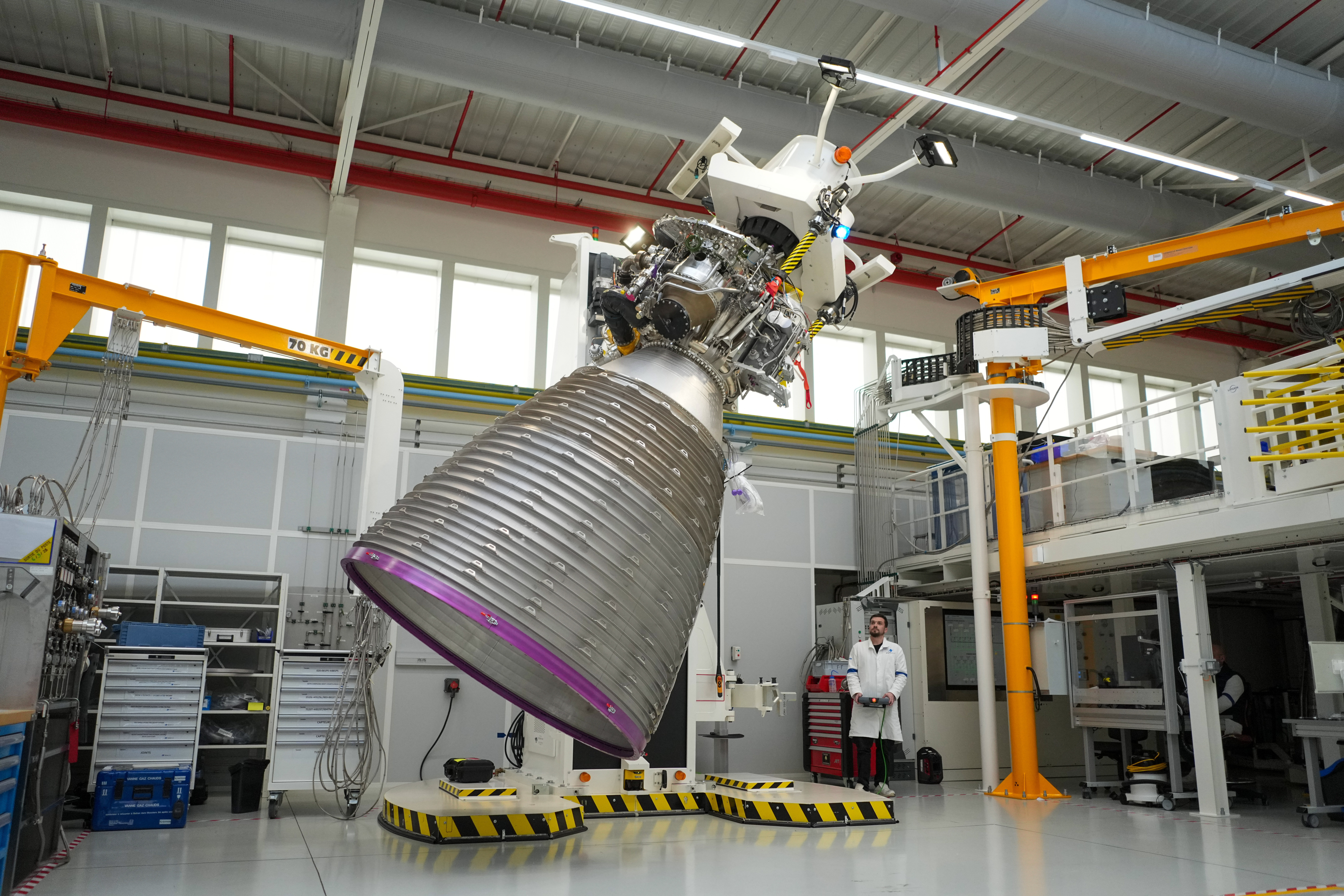 A mechanic works on the Vulcain 2.1 engine that powers the Ariane 64 rocket, at the ArianeGroup's plant in Vernon, west of Paris, Wednesday, Feb. 4, 2026.