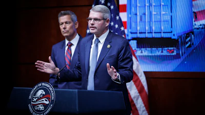 Federal Motor Carrier Safety Administrator Derek Barrs speaks beside Transportation Secretary Sean Duffy, left, during a news conference at the U.S. Department of Transportation, Feb. 20, 2026, Washington.
