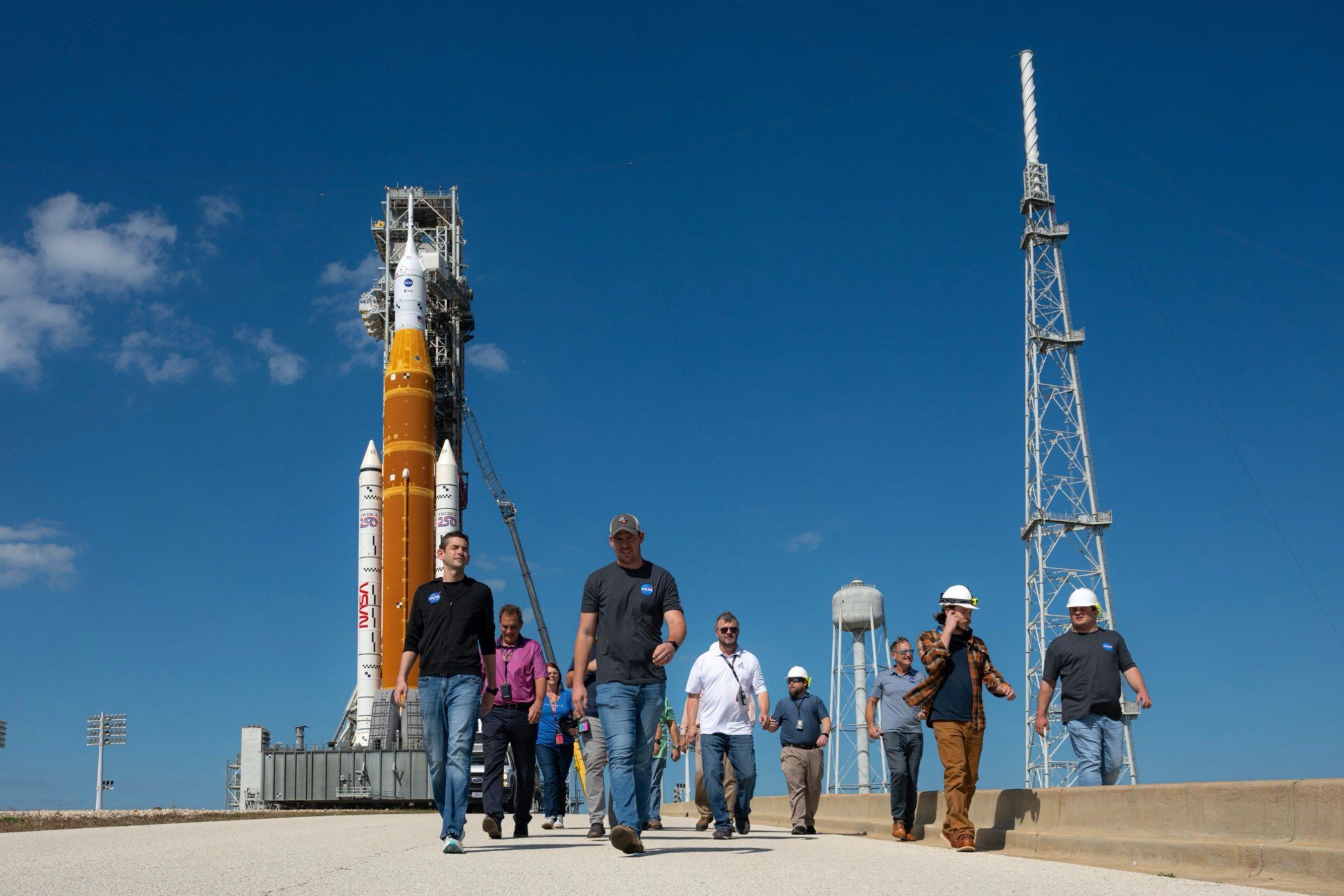 This image provided by NASA shows NASA Administrator Jared Isaacman, left, walking at the Kennedy Space Center launch pad in Cape Canaveral, Fla., Saturday, Feb. 21, 2026.