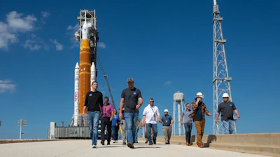 This image provided by NASA shows NASA Administrator Jared Isaacman, left, walking at the Kennedy Space Center launch pad in Cape Canaveral, Fla., Saturday, Feb. 21, 2026.