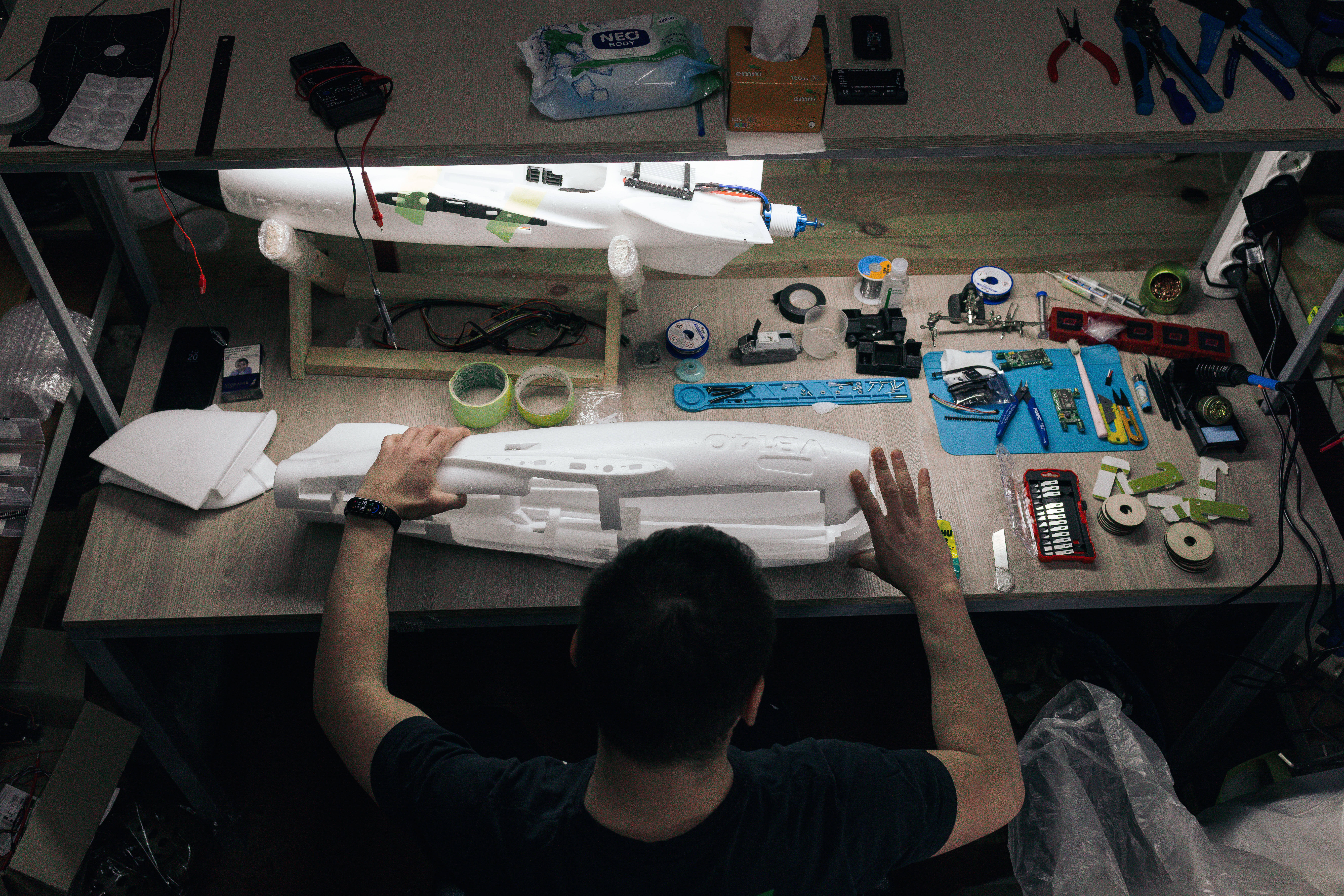 A soldier of the 127th Separate Territorial Brigade mounts a drone at a workshop on the front line in the Kharkiv region Friday, March 13, 2026.
