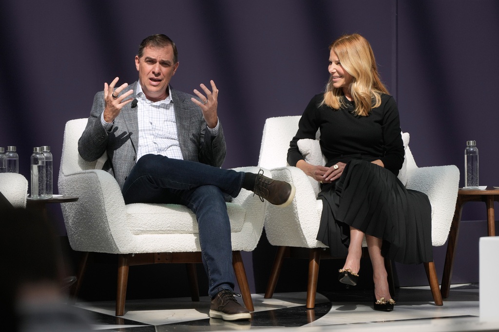 Matt Garman, CEO of AWS, left, speaks next to Denise Dresser, chief revenue officer of OpenAI, at a What's Next with AWS event Tuesday, April 28, 2026, in San Francisco.