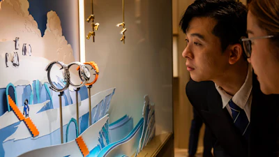 Visitors look at watches at the Swiss watch manufacturer Vacheron Constantin stand, during the opening day of the 'Watches and Wonders Geneva' luxury watch fair, in Geneva, Switzerland, Tuesday, April 14, 2026.