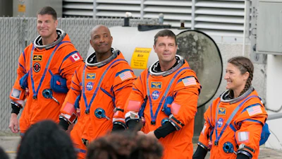 Astronauts, from left, Mission Specialist Jeremy Hansen, of Canada, Pilot Victor Glover, Commander Reid Wiseman, and Mission Specialist Christina Koch pose for a photo after leaving the Operations and Checkout Building for a trip to Launch Pad 39-B and a planned liftoff on NASA's Artemis II moon rocket at the Kennedy Space Center Wednesday, April 1, 2026, in Cape Canaveral, Fla.