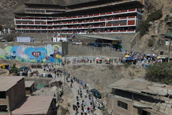 Voters line up outside a polling station during general elections in Lima, Peru, Sunday, April 12, 2026.