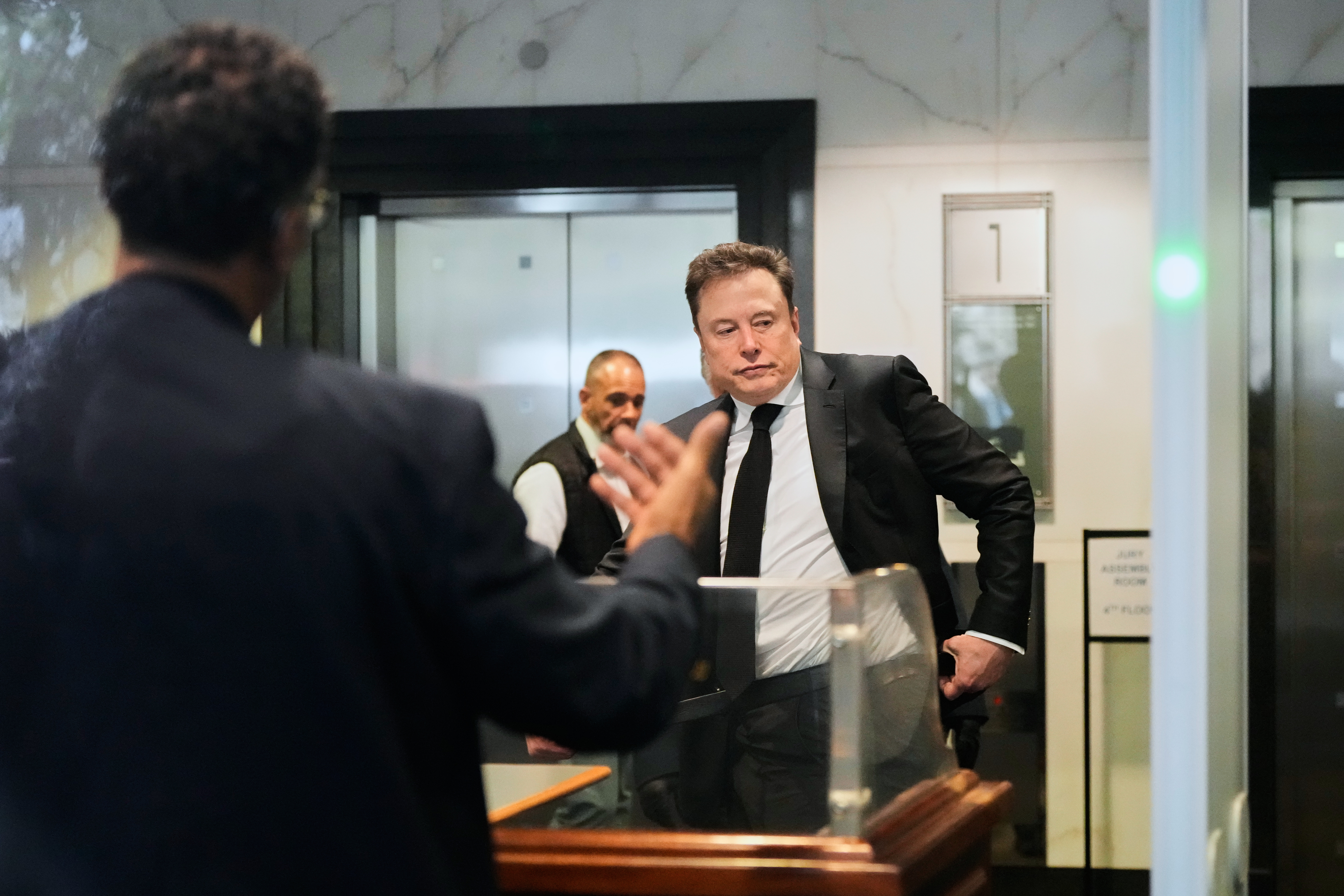 Elon Musk arrives at the U.S. District Court in Oakland, Calif., Tuesday, April 28, 2026.