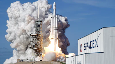 A Falcon 9 SpaceX heavy rocket lifts off from pad 39A at the Kennedy Space Center in Cape Canaveral, Fla., Tuesday, Feb. 6, 2018.