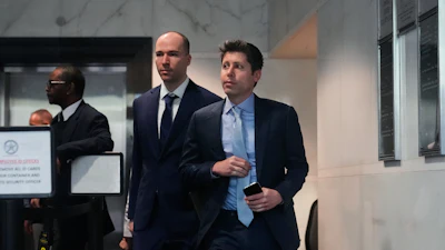 Sam Altman, right, and OpenAI president Greg Brockman, center, arrive at the U.S. District Court in Oakland, Calif., Thursday, April 30, 2026.