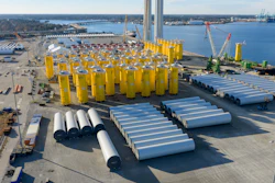 Wind turbine bases, generators and blades are positioned along with support ships at The Portsmouth Marine terminal at the staging area for Dominion Energy's wind turbine project Monday Dec. 22, 2025, in Portsmouth, Va.