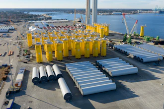 Wind turbine bases, generators and blades are positioned along with support ships at The Portsmouth Marine terminal at the staging area for Dominion Energy's wind turbine project Monday Dec. 22, 2025, in Portsmouth, Va.