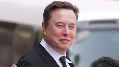 Elon Musk departs after a welcome ceremony with President Donald Trump and China's President Xi Jinping at the Great Hall of the People, Thursday, May 14, 2026, in Beijing.