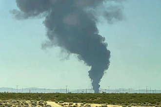 Smoke plumes rise from a B-52 bomber that crashed shortly after takeoff at a U.S. Air Force base in Southern California, Monday, June 15, 2026.