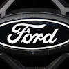 The company logo is shown on the grille of an unsold 2026 F-series pickup truck on the lot of a Ford dealership Sunday, Nov. 2, 2025, in Littleton, Colo.