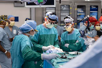 Dr. Matthew Willsey (middle) secures the Connexus BCI after implantation.