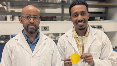 Professor Tizazu Mekonnen (left) and PhD student Aklilu G. Messele holding the flexible polymer material developed to replace the lead in heavy X-ray aprons.