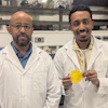 Professor Tizazu Mekonnen (left) and PhD student Aklilu G. Messele holding the flexible polymer material developed to replace the lead in heavy X-ray aprons.