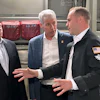 Energy Secretary Chris Wright, center, and Under Secretary of Defense Michael Duffey, left, listen as Isaiah Taylor, CEO of Valar Atomics, discusses a microreactor developed by Valar to generate nuclear power for the military and commercial customers, Feb. 15, 2026, in-flight, on board a C-17.