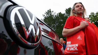 Employees of carmaker Volkswagen AG and IG Metall union members rally on the grounds of the Volkswagen headquarters on the day of the supervisory board meeting, in Wolfsburg, Germany, Thursday, July 9, 2026.