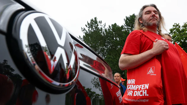 Employees of carmaker Volkswagen AG and IG Metall union members rally on the grounds of the Volkswagen headquarters on the day of the supervisory board meeting, in Wolfsburg, Germany, Thursday, July 9, 2026.