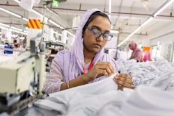 Ruma Aktar, a sewing machine operator, wears her prescription eyeglasses while working at a garment factory in Gazipur, on the outskirts of Dhaka, Bangladesh, June 30, 2026.