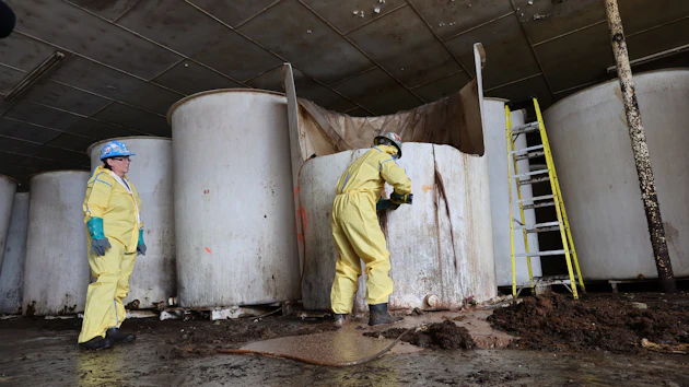 Sludge pours out of a vat of fermenting fish sauce in an abandoned factory, St. Mary's, Newfoundland and Labrador, July 28, 2026.