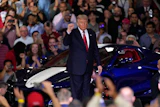 President Donald Trump arrives to speak at an event at the General Motors Proving Ground Monday, July 27, 2026, in Milford, Mich.